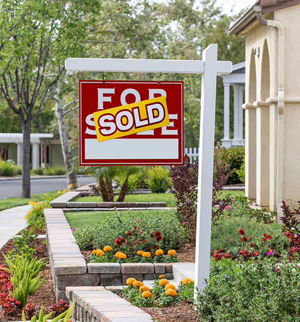 home sale program management solutions - sold sign in front of a home